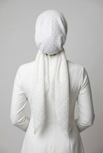Load image into Gallery viewer, White headscarf with star patterns draped over a mannequin head on a white background