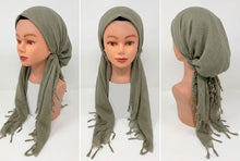 Load image into Gallery viewer, Mannequin head wearing a green headscarf with fringes on a white background
