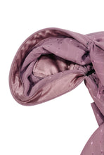 Load image into Gallery viewer, Close-up of a pink polka dot fabric with a black interior on a white background