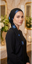 Load image into Gallery viewer, Black headscarf with blue star patterns on a mannequin head against a white background