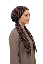 Load image into Gallery viewer, Woman wearing a patterned headscarf on a white background