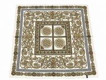 Load image into Gallery viewer, A square scarf featuring an ornate baroque pattern in olive green and brown on a cream background, with a Greek key border.
