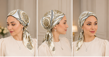 Load image into Gallery viewer, A woman modeling a patterned silk scarf in multiple views, including close-ups of the headscarf and a full-body shot wearing a cream dress with a handbag. A detail panel shows the scarf's ornate paisley and floral pattern.

