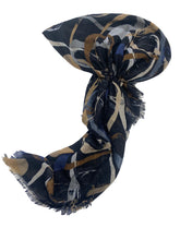 Load image into Gallery viewer, A lightweight scarf with a dark navy blue abstract pattern, featuring beige, brown, and white brushstroke details, styled on a white surface.
