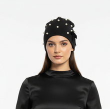 Load image into Gallery viewer, Model wearing black beanie with white pearls
